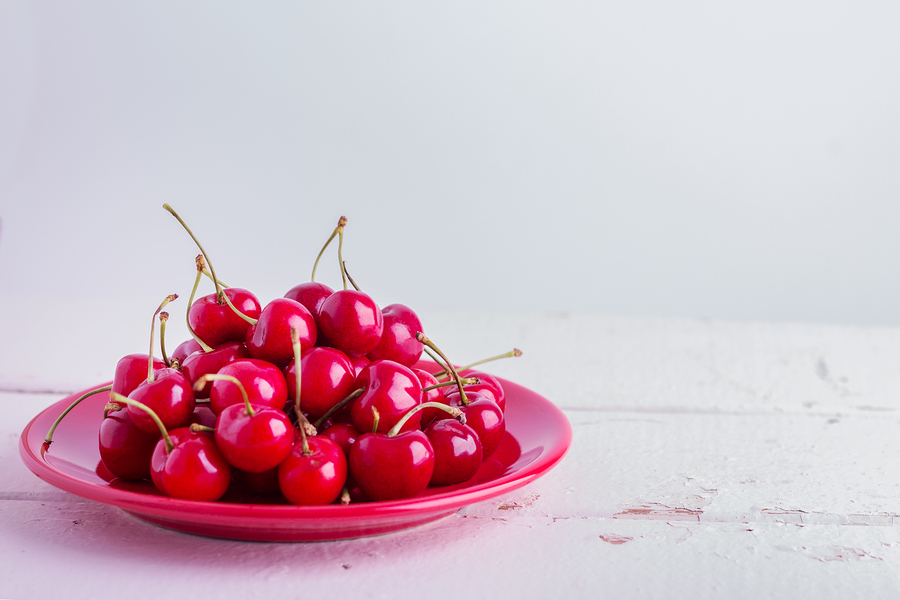 Cherries on a Red Plate