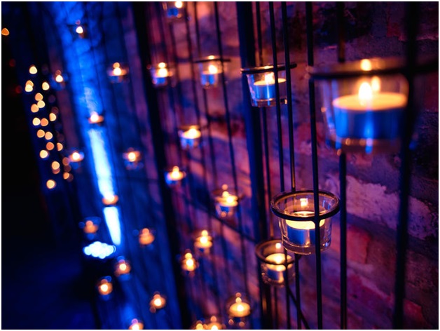 Candles on a Brick Wall