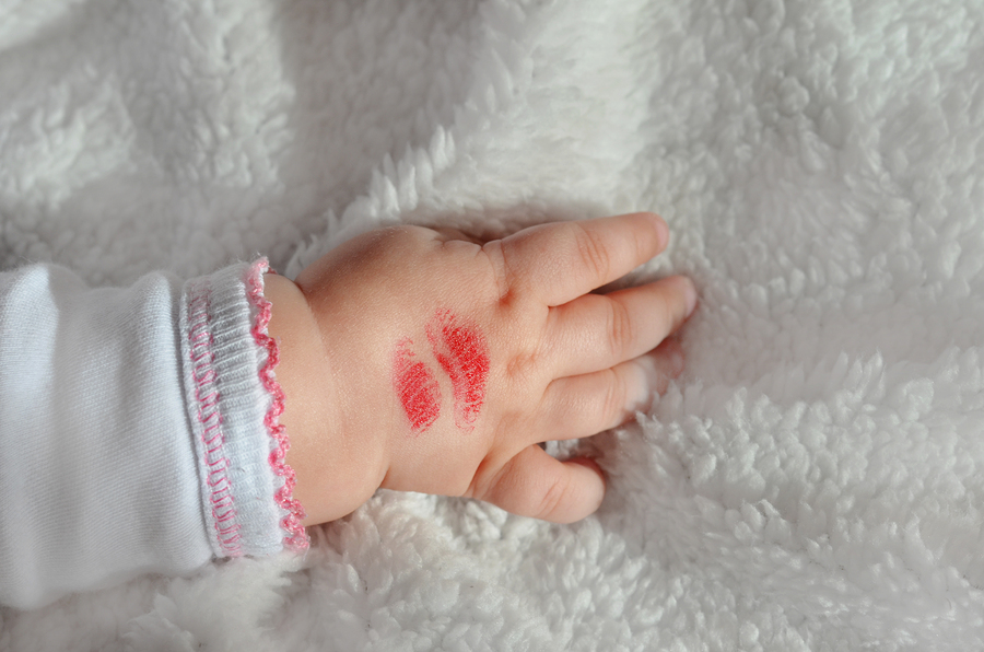 A Lipstick Kiss on a Baby's Hand